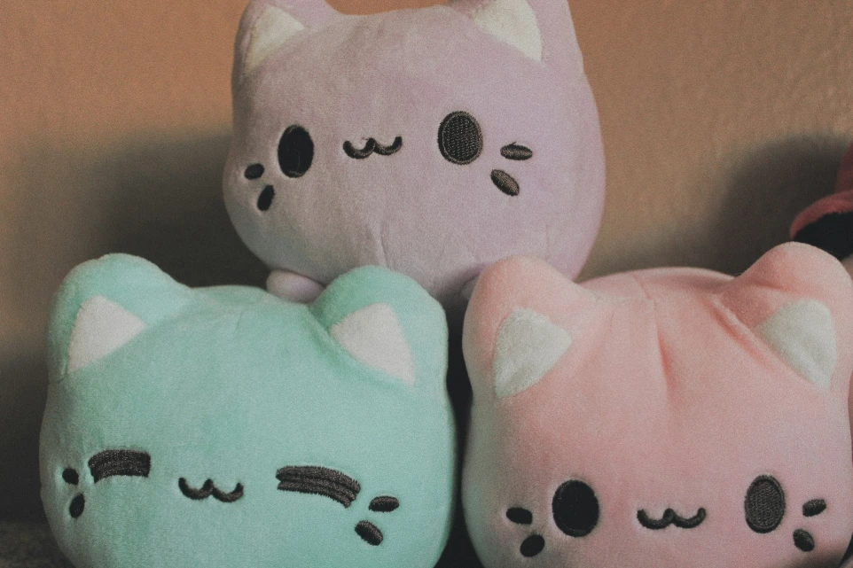 a couple of stuffed animals sitting next to each other